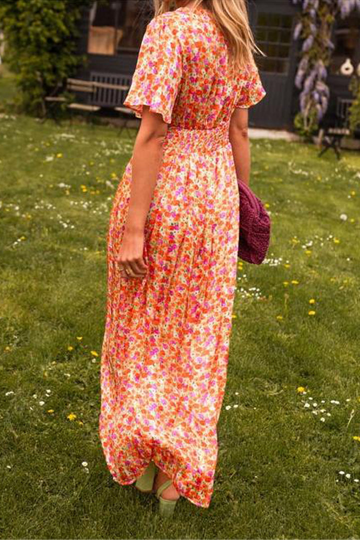 Flowy women's floral maxi dress with V-neck, ideal for summer beach days or casual spring outings.