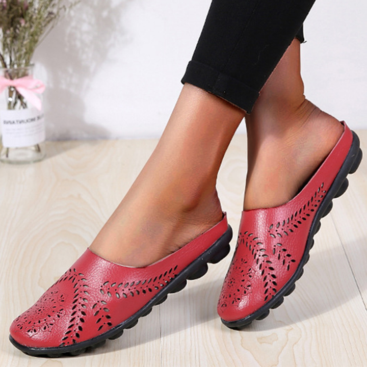 Textured women's orthopedic clogs, emphasizing breathable design and comfortable fit.