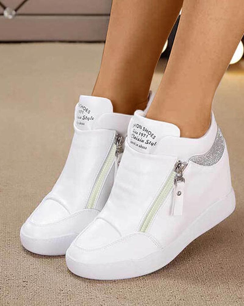 Chic women's wedge heel sports shoes. Comfortable platform sneakers for everyday wear, blending fashion and casual elegance.