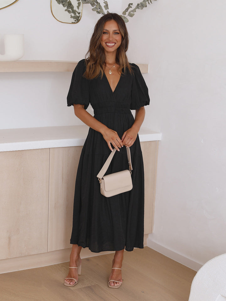 V-neck detail of a women's elegant cocktail midi dress, great for evening wear & special occasions.