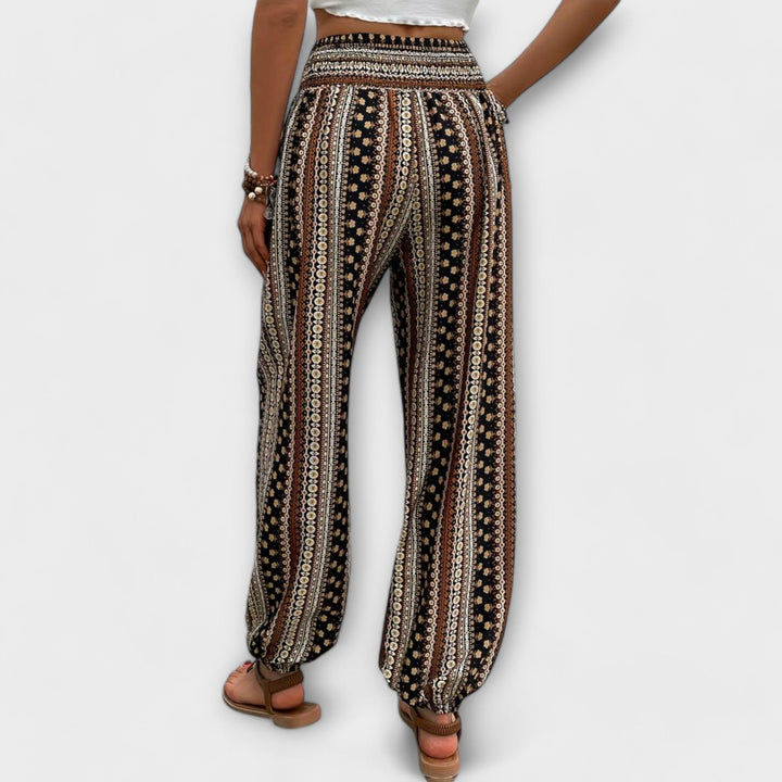 Stylish women's pants featuring a vibrant ethnic graphic print, ideal for comfort.