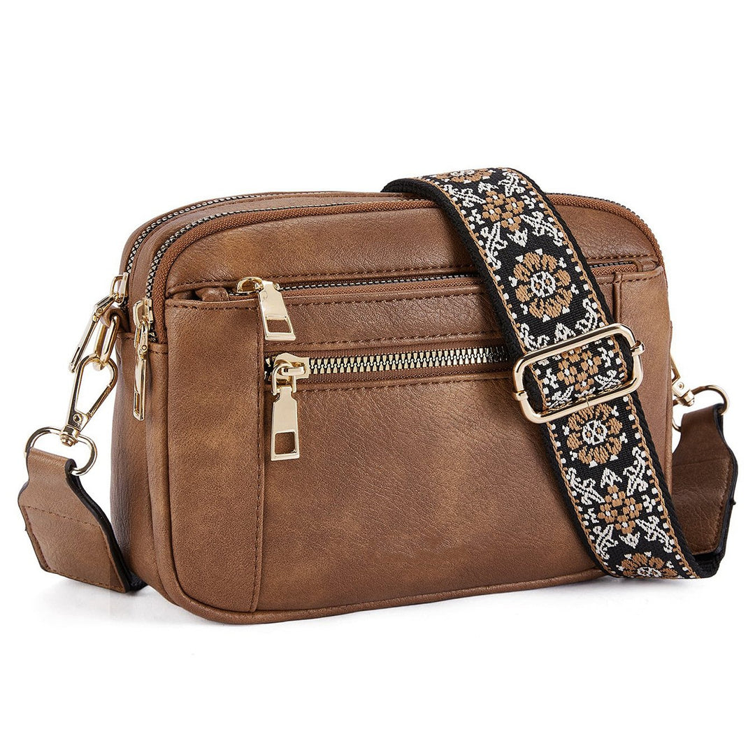 Organized women's crossbody purse with multiple pockets & adjustable strap for daily essentials.