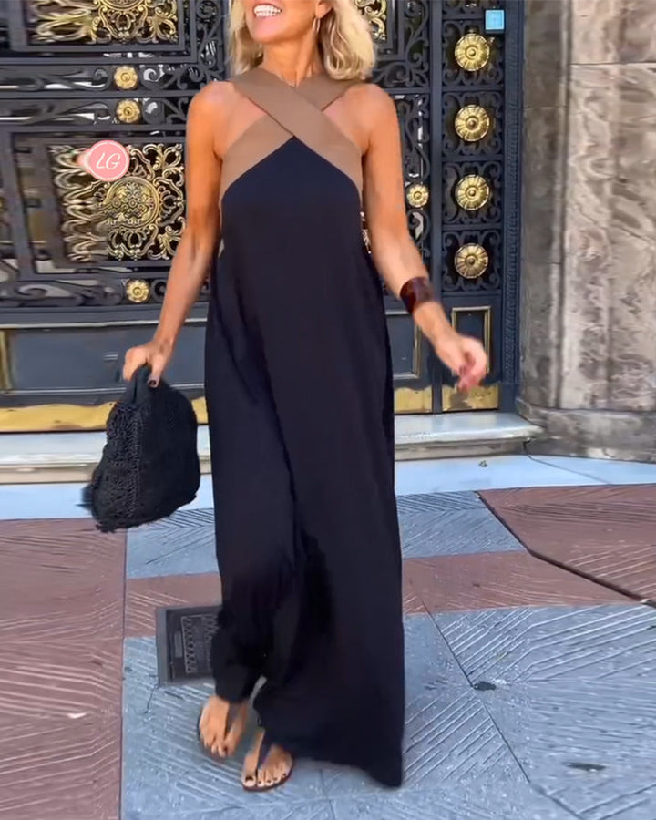Stunning formal cross neck maxi dress for women. A sleeveless, elegant, long dress for glamorous occasions.