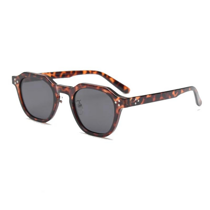 Stylish UV400 sunglasses, black lenses, modern angular design.