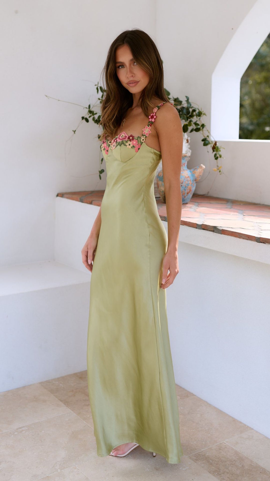 Women's elegant maxi dress featuring a vibrant floral print, ideal for a chic summer or evening look.