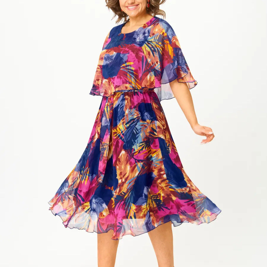 Elegant plus size women's summer midi dress, vibrant patterned A-line, flowing and comfortable for vacation style.
