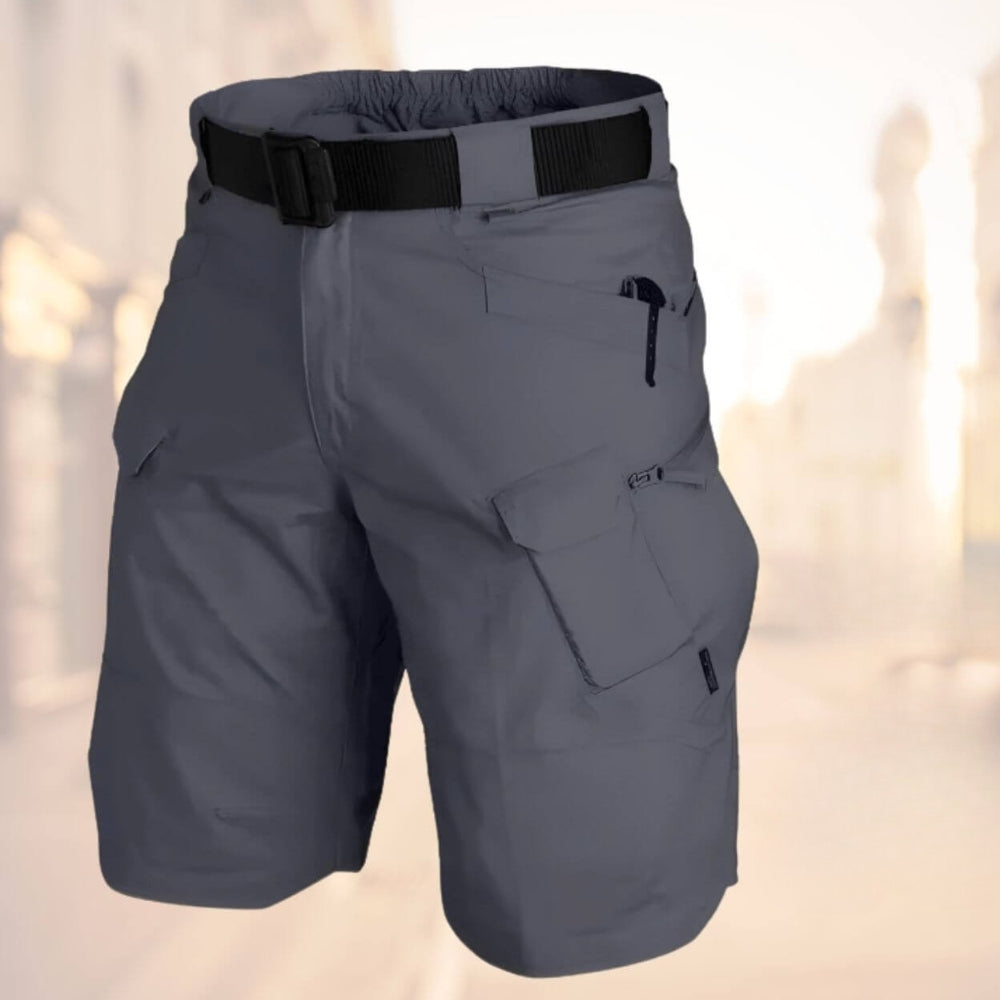 Green men's multi-pocket cargo shorts, built for utility, active wear & summer outdoor adventures.