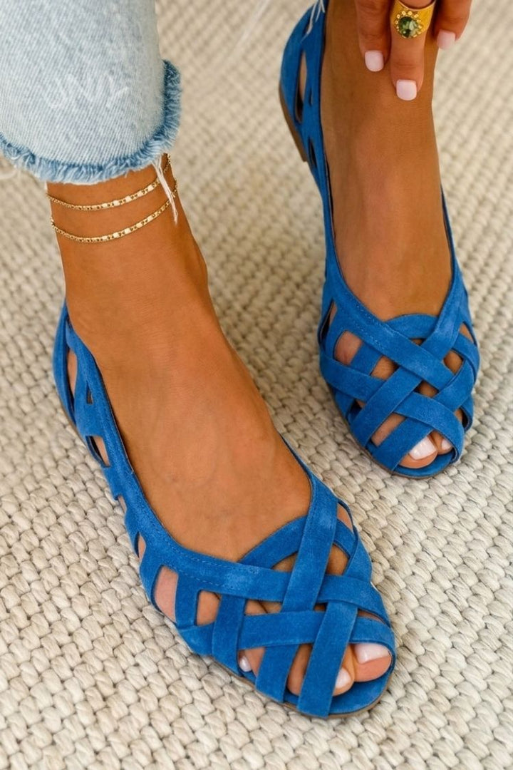 Flat open toe cross-strap sandals for women, offering comfort and summer style.