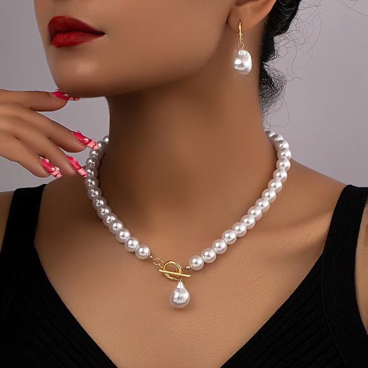 Elegant women's vintage pearl necklace & matching drop earrings set, perfect for special occasions & gifts.