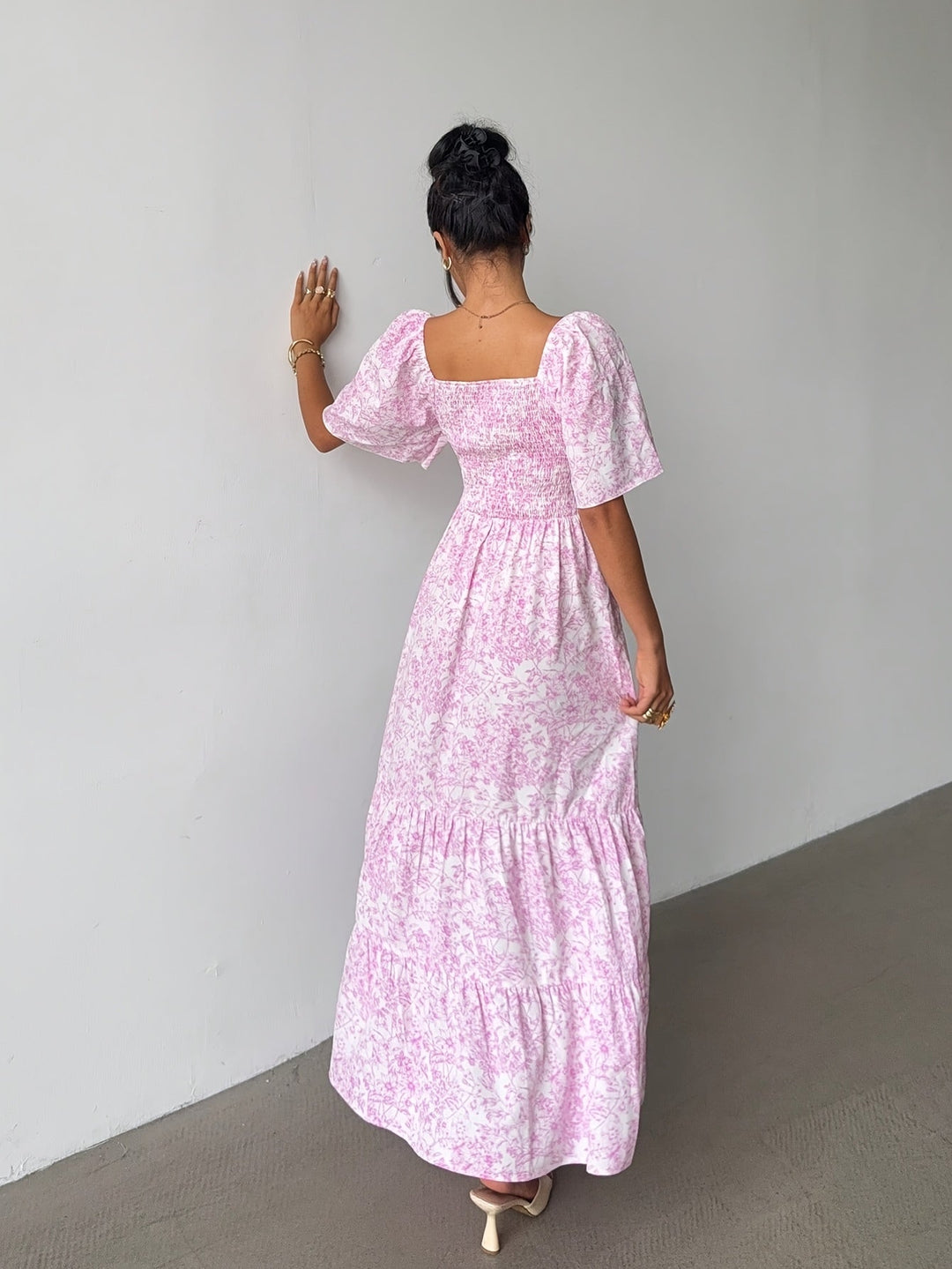 Light blue floral tiered maxi dress for women, featuring a sweetheart neckline & flowy silhouette.