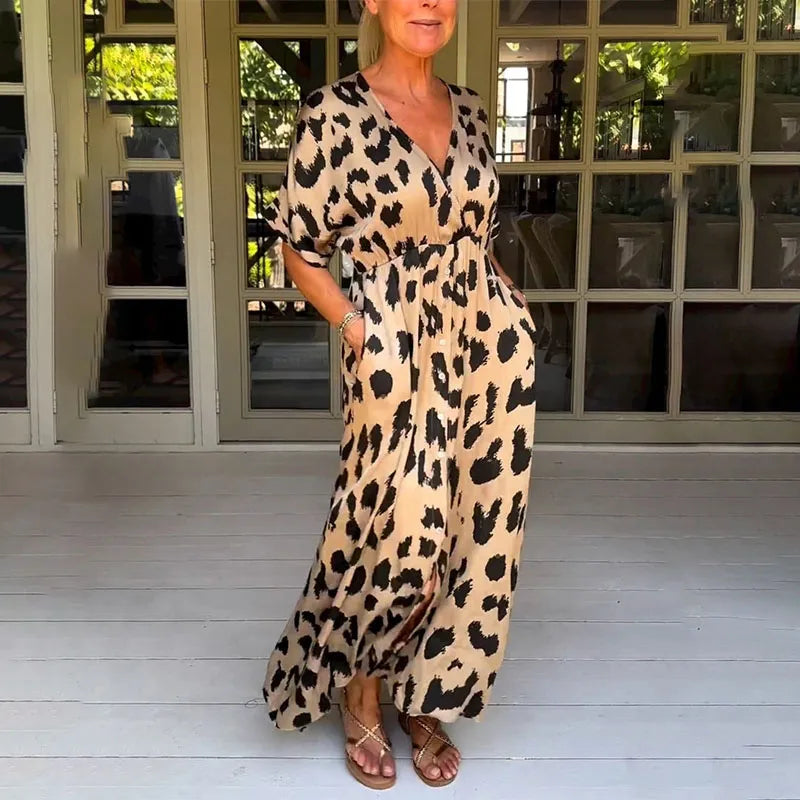 Comfortable women's flowy maxi dress featuring a chic v-neck & trendy leopard print. Long summer animal print dress.
