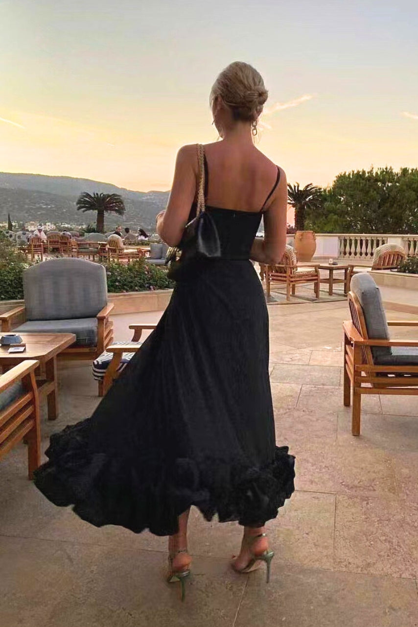 Back view of women's elegant flowing midi dress, a chic and versatile choice for wedding guests & cocktail parties.