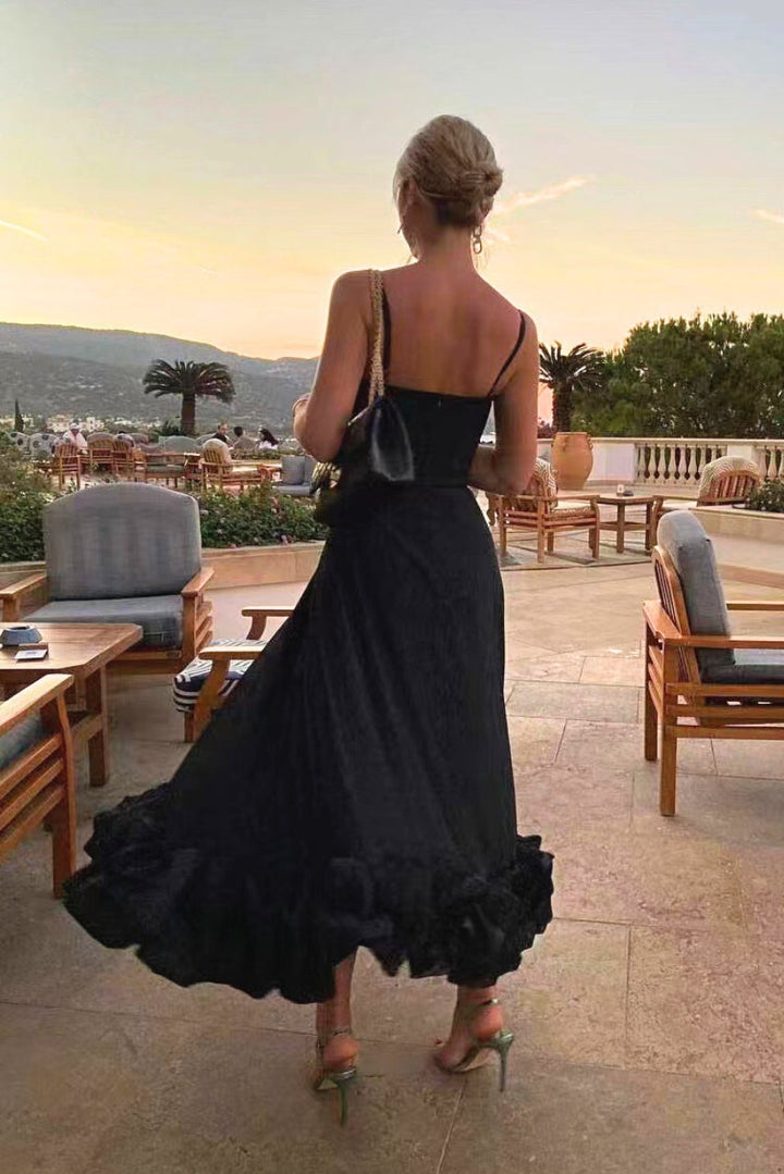 Back view of women's elegant flowing midi dress, a chic and versatile choice for wedding guests & cocktail parties.