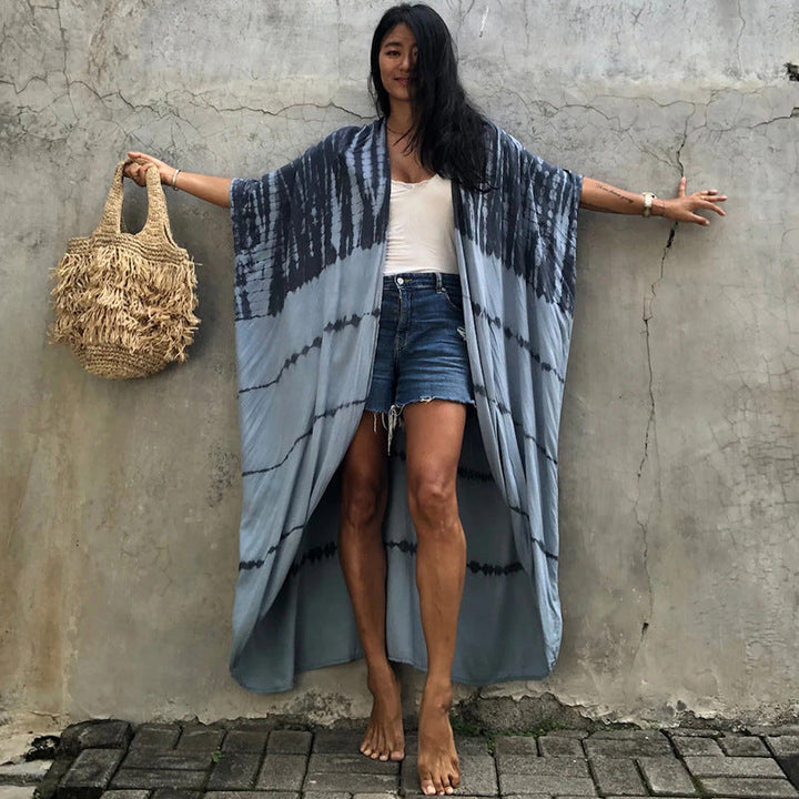Stylish women's sun protection cover up, glamorous beachwear, perfect for vacation outfits.