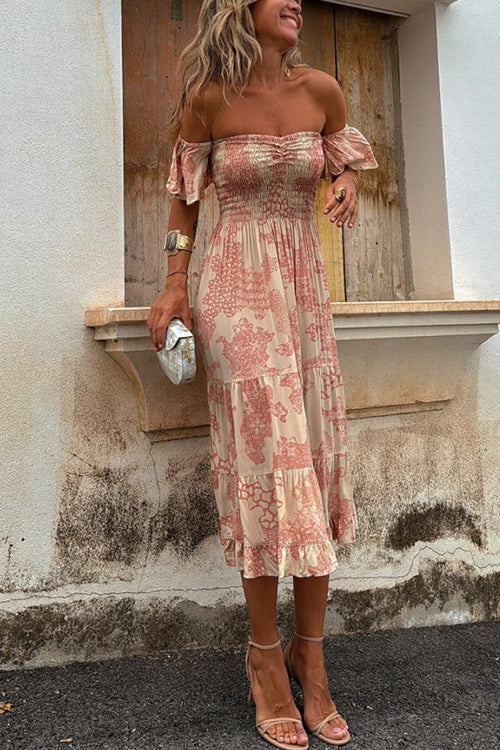 Women's elegant off-shoulder pink smocked tiered midi dress. A stylish choice for summer, holidays, or romantic occasions.