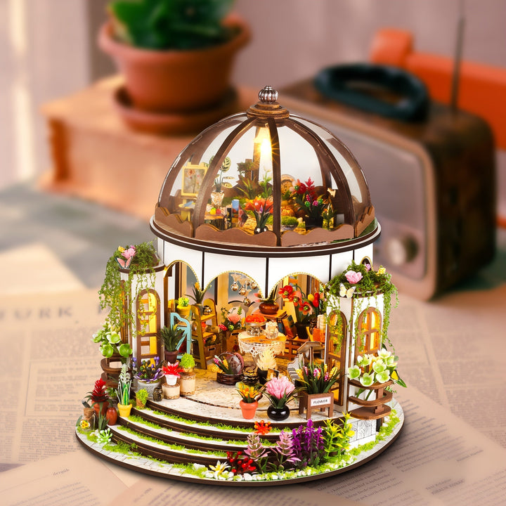 Intricately designed miniature flower house 3D wooden puzzle, perfect as home decor with warm LED illumination.