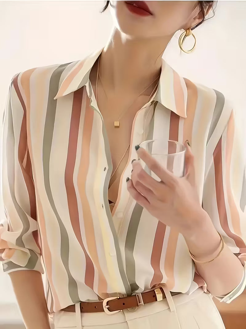 Model wearing a women's striped button-up shirt, showcasing its relaxed fit and elegant casual style for any occasion.