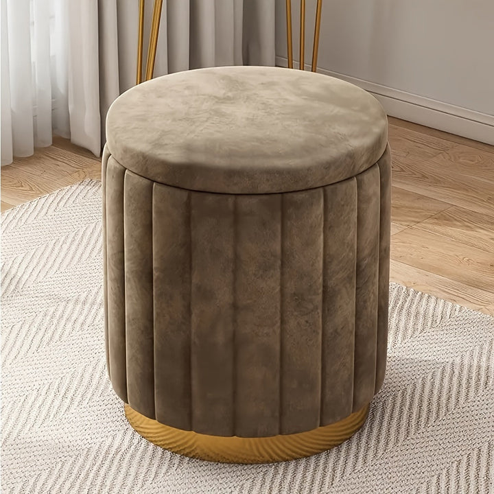 Upholstered round storage ottoman, mirrored base, perfect for modern homes.