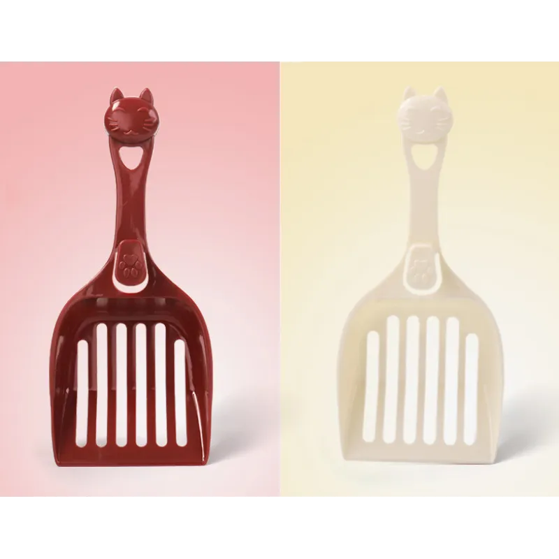 Essential pet care cleaning tool: durable plastic cat litter scoop featuring a cute cat head design.