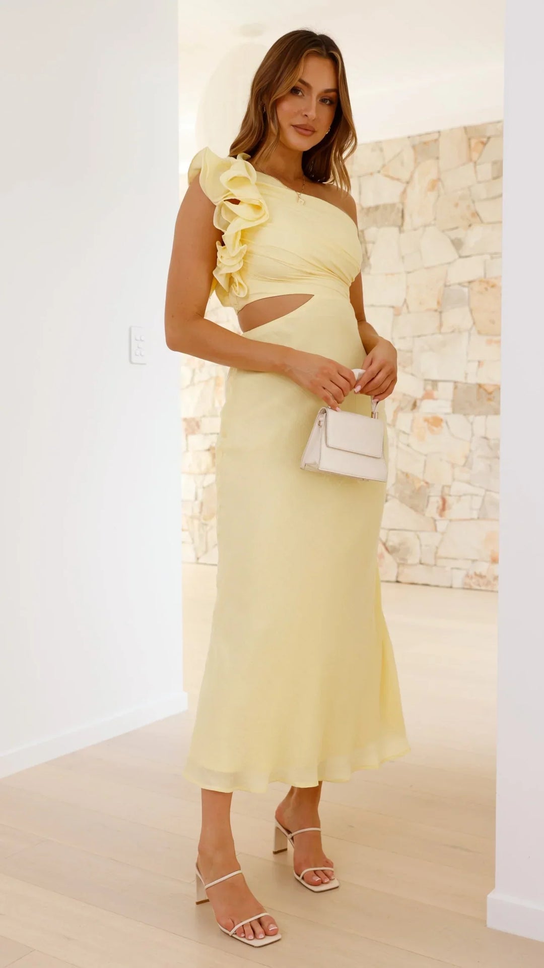 Chic women's yellow one-shoulder maxi dress, ideal occasion wear with cutout & elegant frill.
