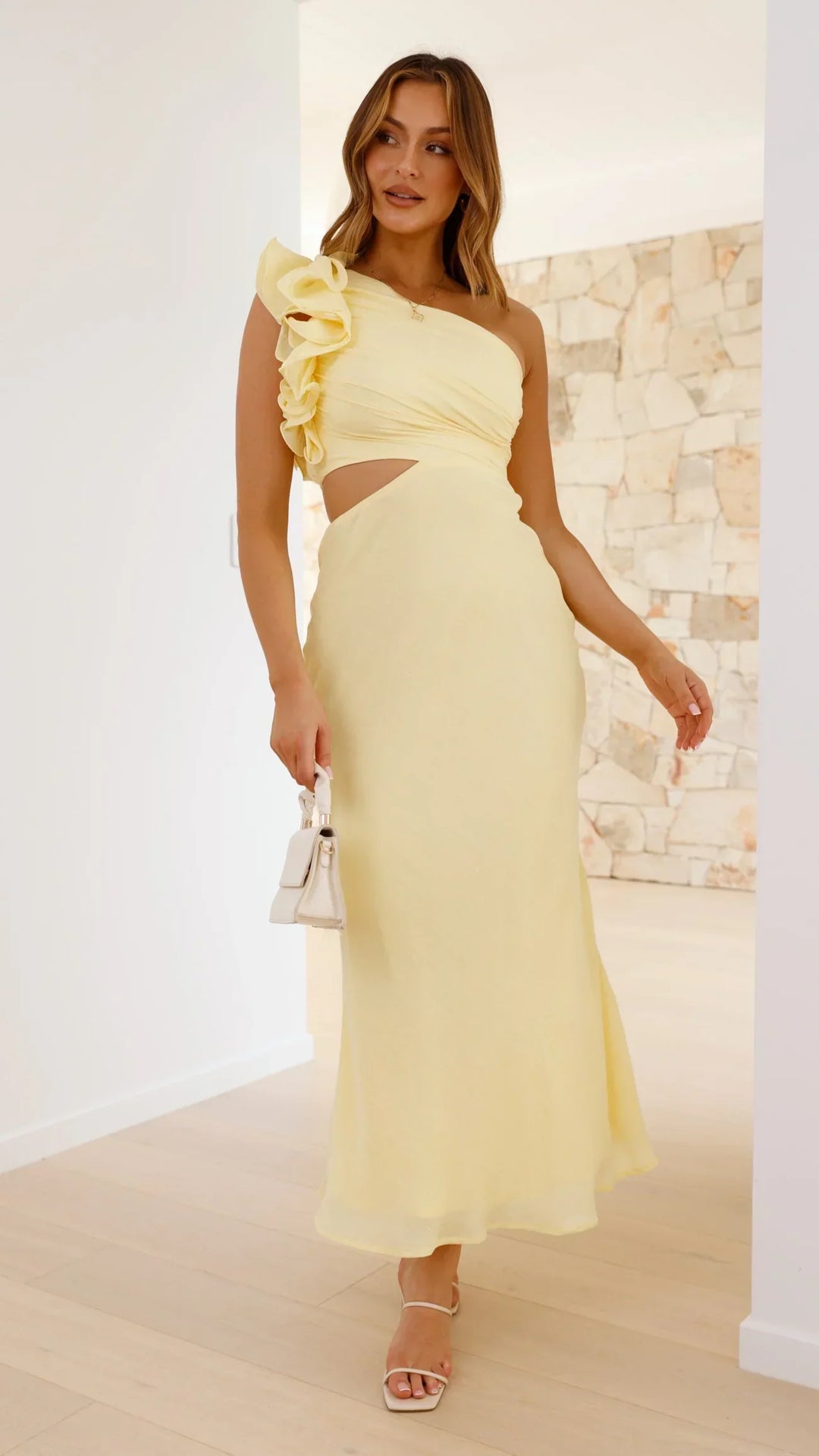 Stunning yellow evening gown: women's elegant one-shoulder maxi dress with a sophisticated cutout.