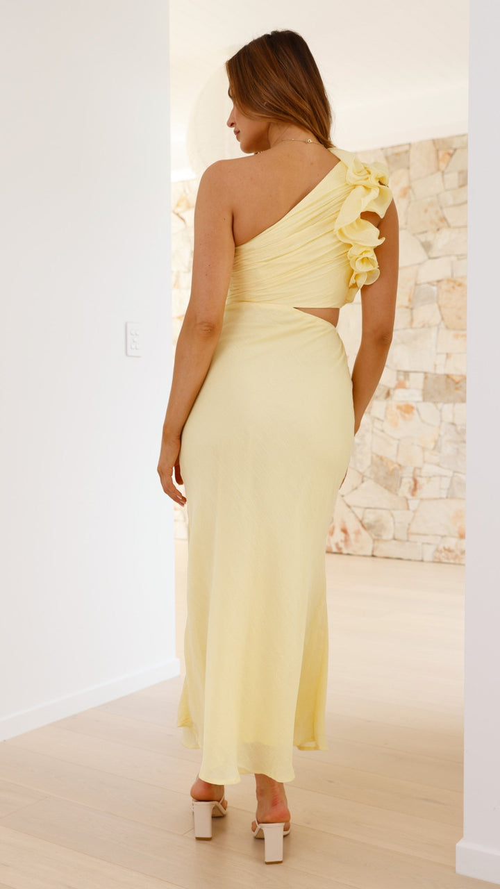 Vibrant yellow elegant one-shoulder maxi dress for women, with a modern cutout & frill detail.