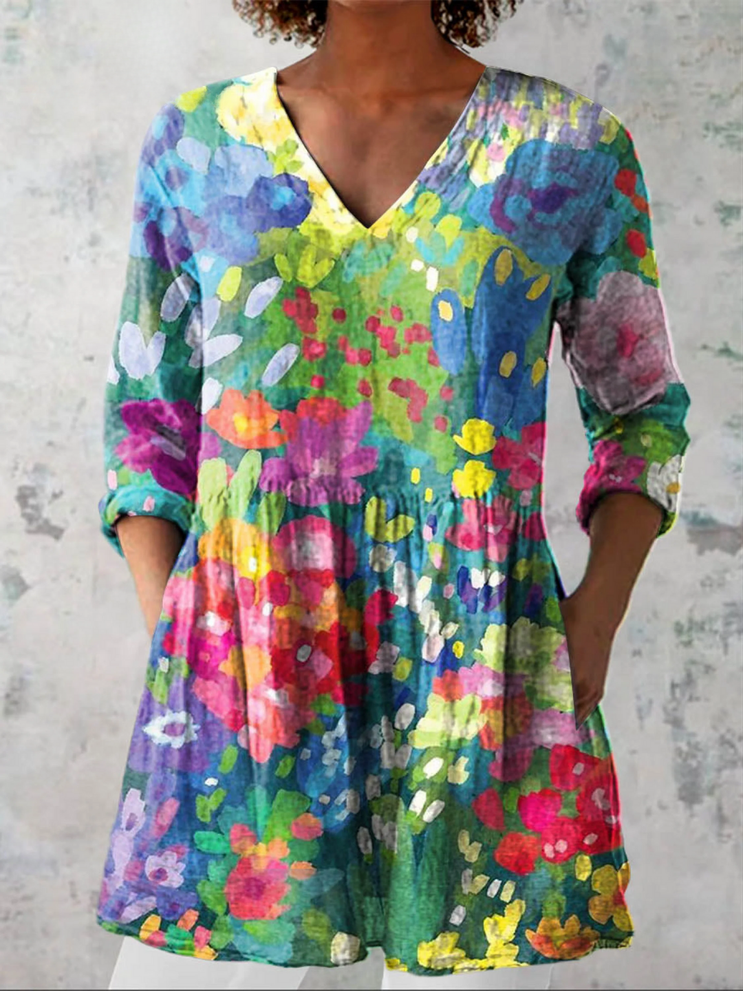 Elegant women's V-neck long blouse in fluid multicolor design for versatile, chic everyday style and comfort.