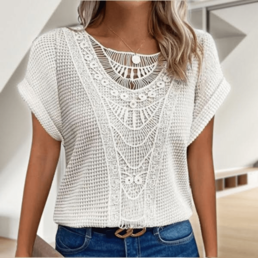 Boho chic women's sleeveless top with intricate details, an elegant Ibiza style flowy tunic for resort wear.