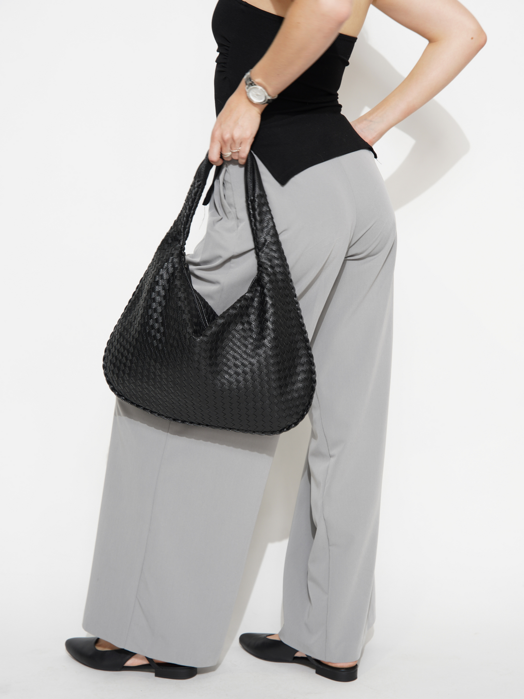 Trendy one shoulder crossbody for women. Fashionable vegan leather handbag.