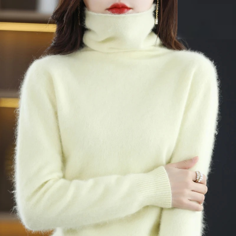 Women's soft turtleneck pullover sweater, luxurious knit for warm winter fashion.