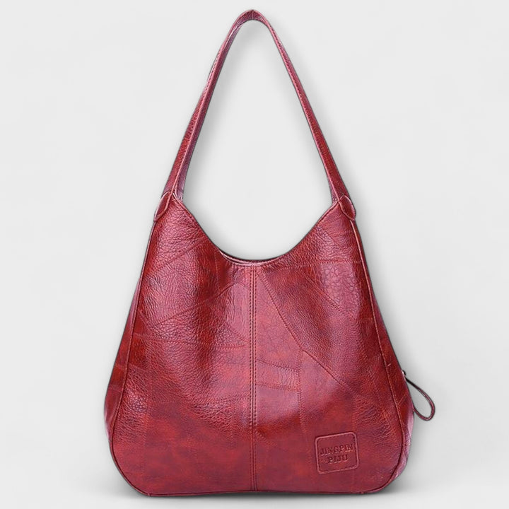 Durable vintage brown leather shoulder bag, a classic women's everyday carryall handbag.