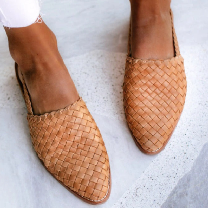 Slip-on handwoven women's sandals providing ultimate foot and arch support for comfort.