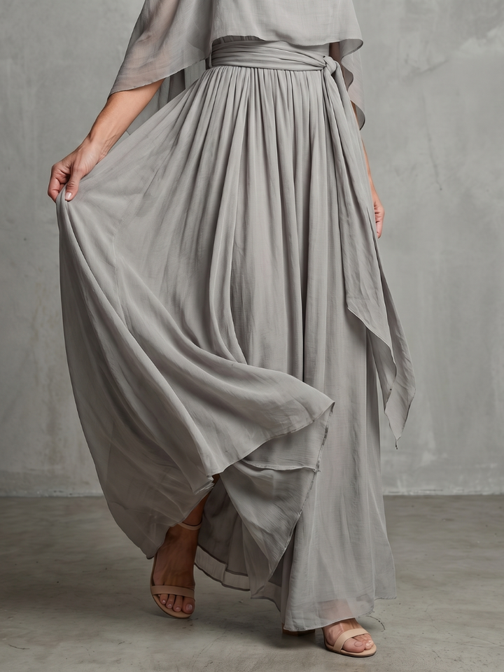 Stylish women's grey layered cold shoulder top & wide leg pants set. Versatile two-piece for spring & summer.