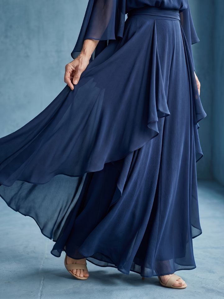 Comfortable and elegant women's navy midi dress. Features fluid layered sleeves & drape waist, ideal for special occasions.