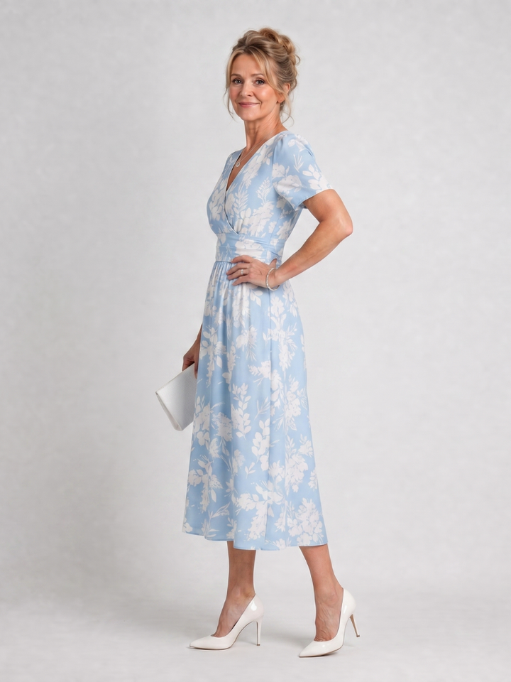 Stylish women's floral print V-neck midi dress, ideal for casual summer day wear. Short sleeves.
