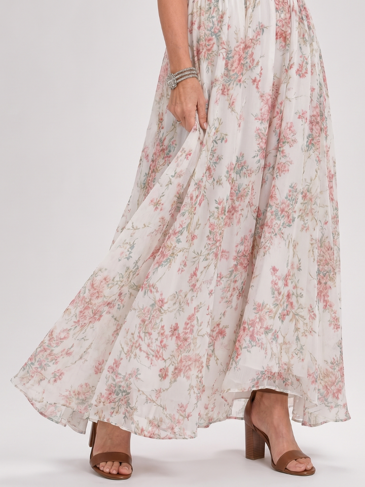 Stylish women's halter midi dress with vibrant floral print, an elegant choice for summer fashion.