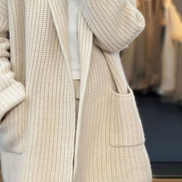 Cozy oversized women's open-front cardigan in a soft knit, offering elegant comfort for any casual outfit.