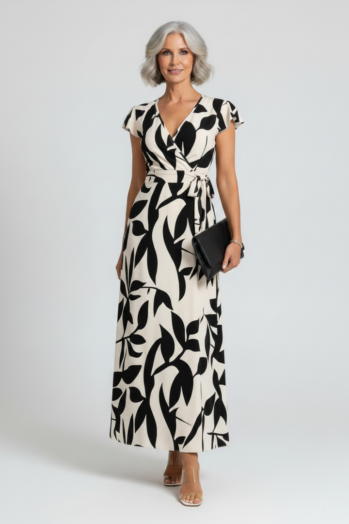 Women's elegant contrast print maxi dress with V-neck & ruffle sleeves, perfect for summer occasions. Chic & stylish.