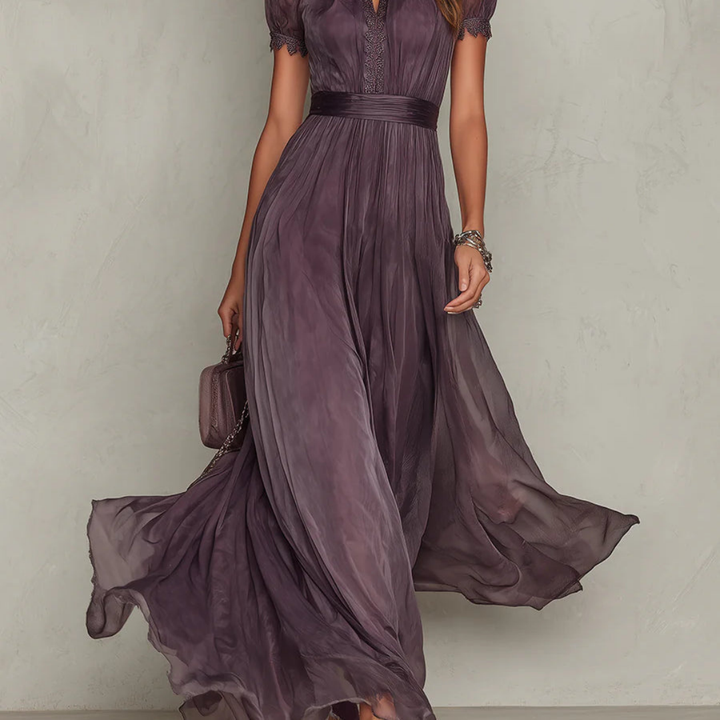 Beautiful purple elegant maxi dress for women featuring delicate lace trim. A perfect long dress for special events.