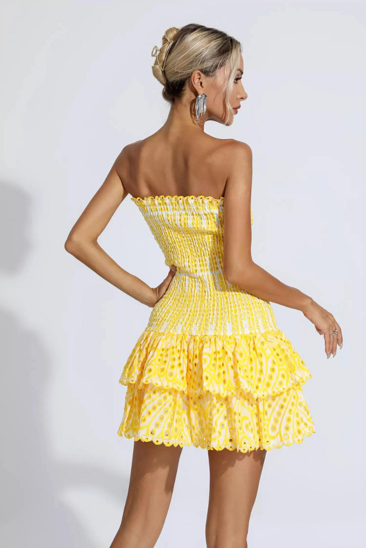 Flowy strapless ruffle mini dress, adds playful movement and elegance to your party outfit.