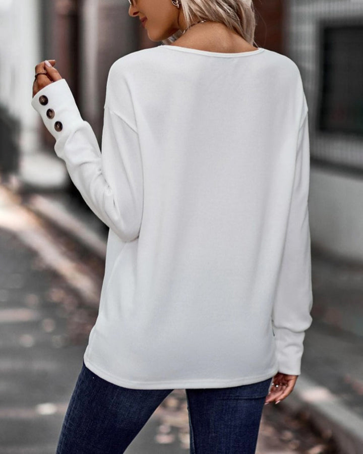 Versatile women's long sleeve V-neck top with unique button detail, suitable for spring & winter.