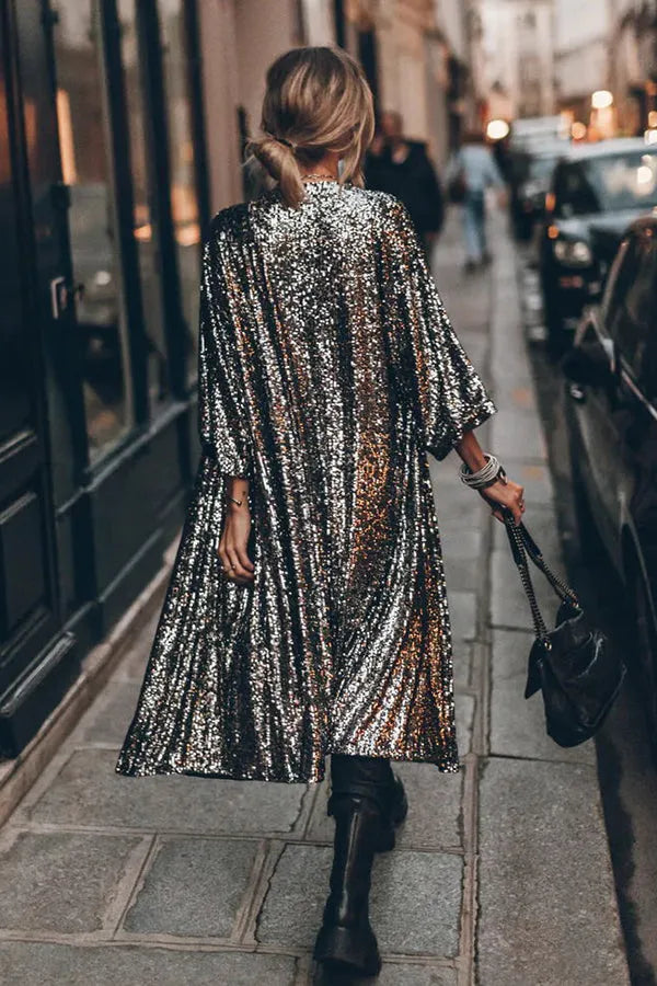 Women's sequined kimono featuring a stylish keyhole and chic bell sleeves. Ideal for festival fashion.