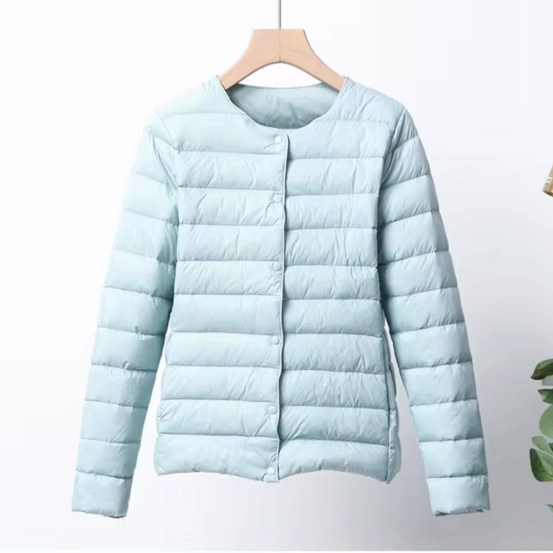 Lightweight women's puffer jacket with an ultrathin design, offering insulated warmth for casual wear.