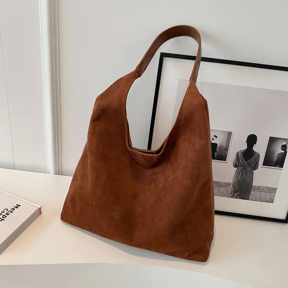 Stylish women's suede tote bag, a versatile everyday carryall handbag.