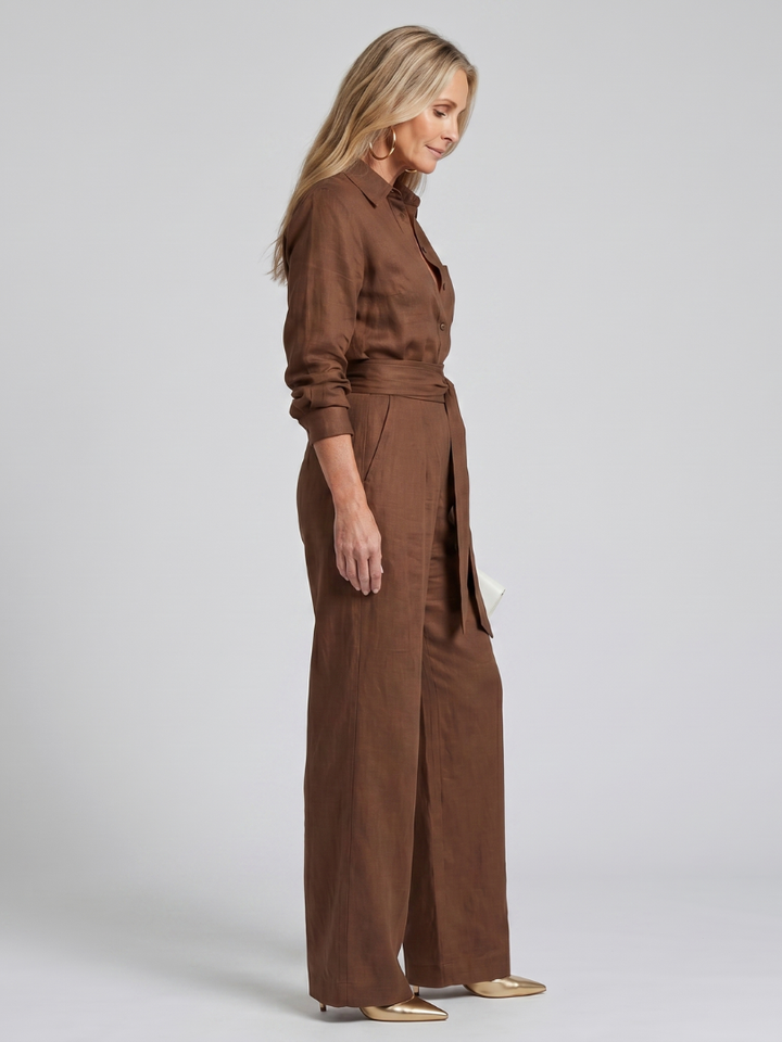 Black elegant women's long sleeve wide leg jumpsuit, comfortable one piece outfit.