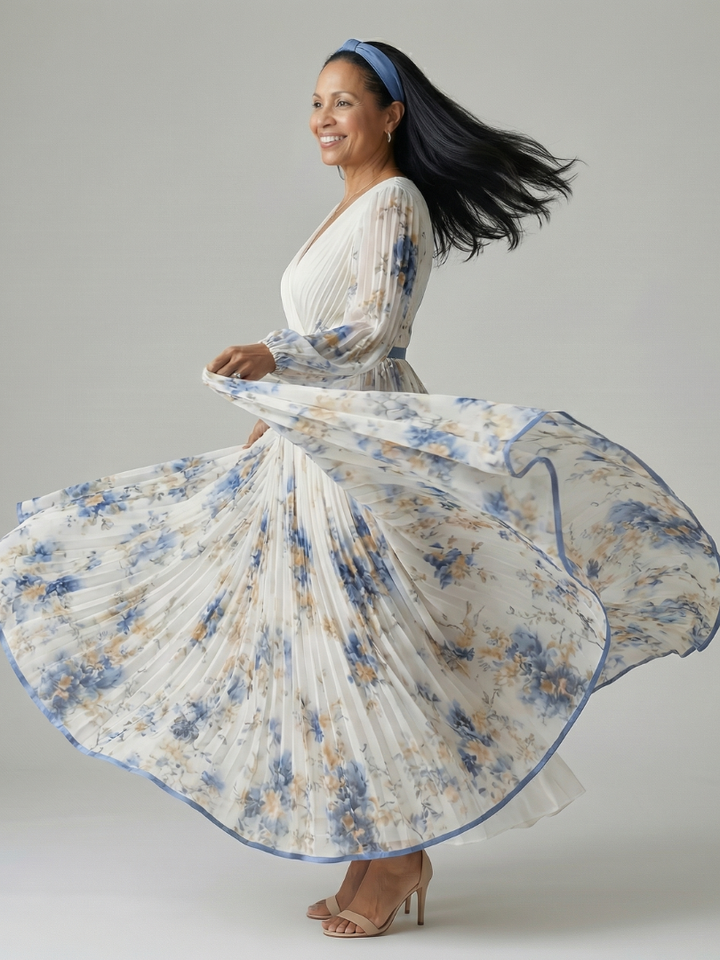 White women's wrap midi dress featuring elegant pleats, long sleeves, V-neck, and a beautiful floral pattern, suitable for events.