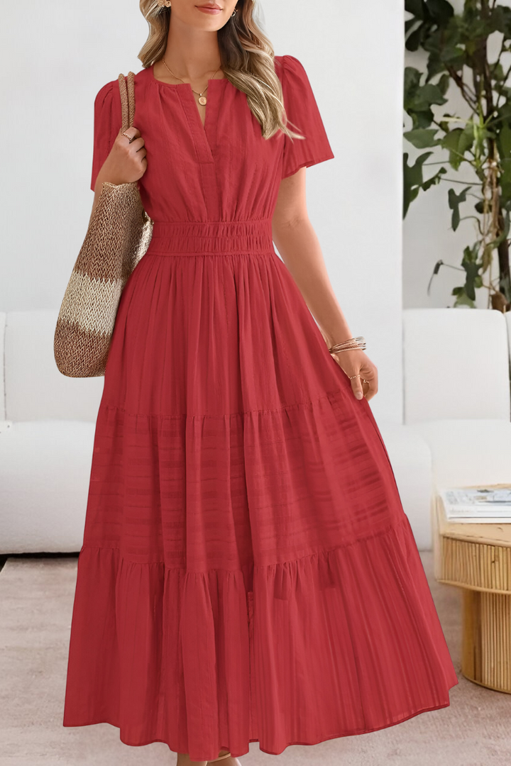 Flowy women's bohemian midi dress, short-sleeve and smocked, a must-have for summer casual wear.