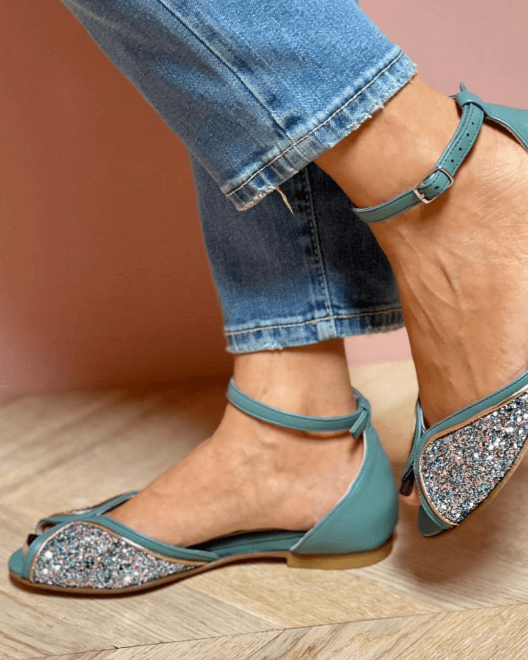 Shimmering green luminous flat sandals for women, featuring a comfortable ankle strap, ideal for special occasions.