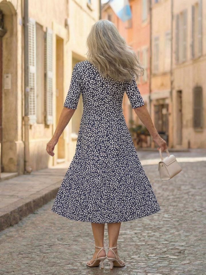 Comfortable women's blue midi dress in a coastal pattern with three-quarter sleeves, perfect for relaxed summer days.