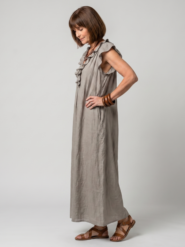 Flowing sleeveless midi dress for women, relaxed fit, elegant ruffle trim, perfect for warm weather.